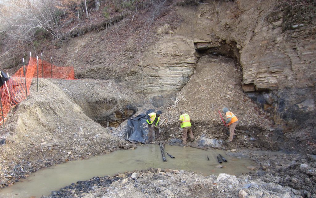 workers cleaning up mine site