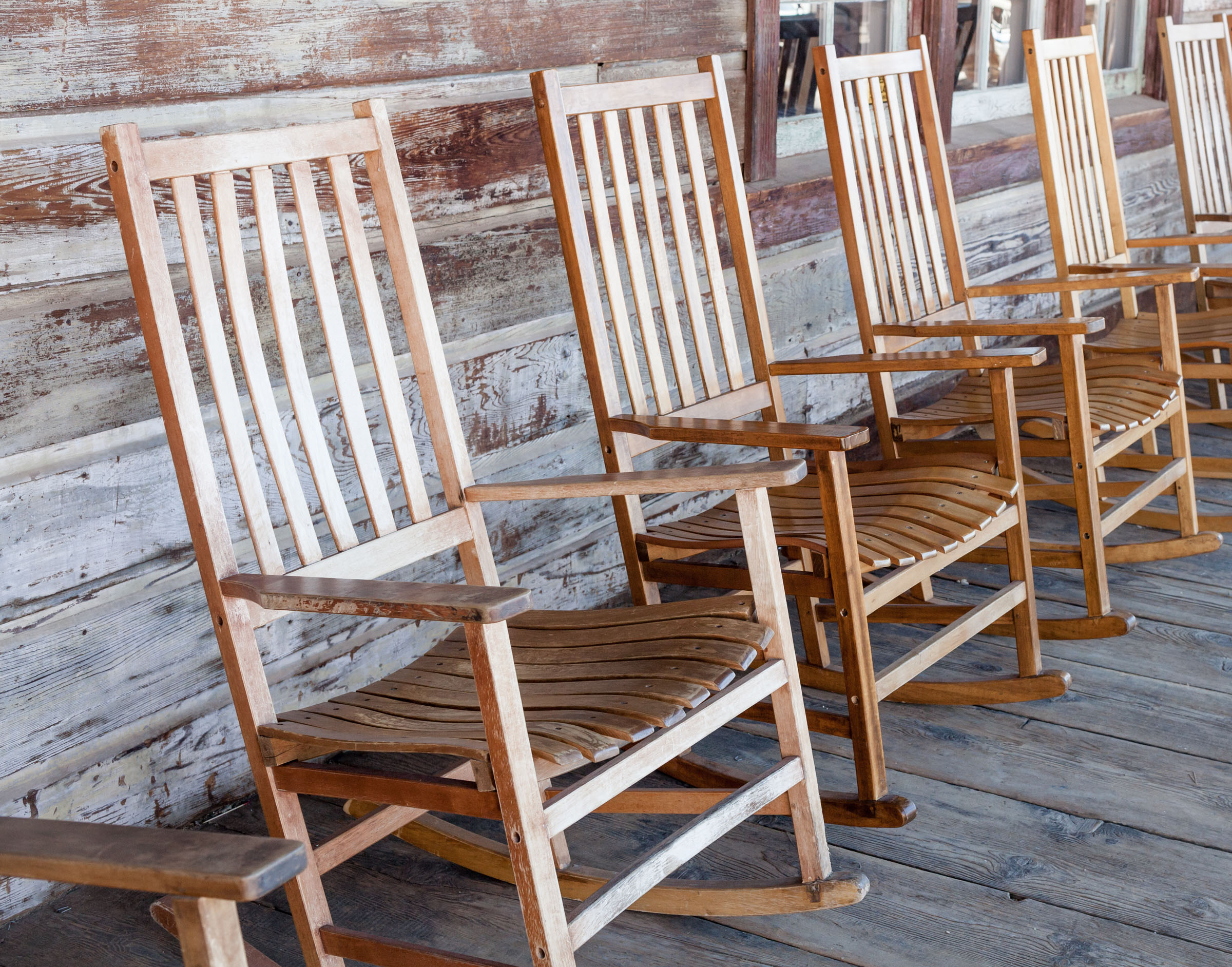 Rocking chairs on a log cabin porch--stock photo