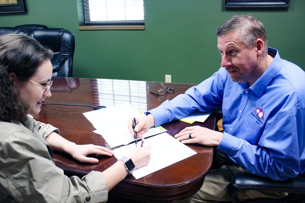 Redbud Financial Alternatives' Managing Director James Caudill providing working with client. Photo courtesy of James Caudill.