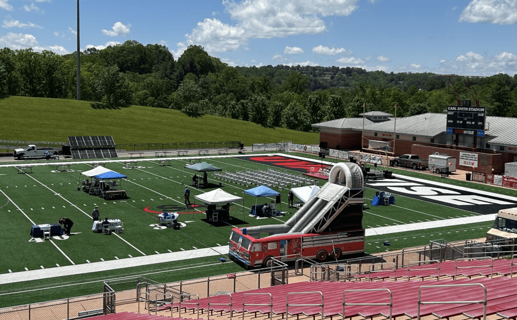 Before the crowd arrived, staff and volunteers worked to prepare Carl Smith Stadium for the SWVA Solar Summit. Photo by Rance Garrison.