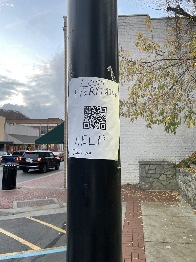 A Watauga County resident posts
a plea for help on a light pole in Boone, N.C., after the storm
destroyed his home and woodshop. Photo by Lou Murrey