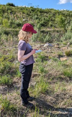 Appalachian Voices staff member Liz Holloway taking field notes at a Green Forests Work plantation in Mammoth Preserve in West Virginia