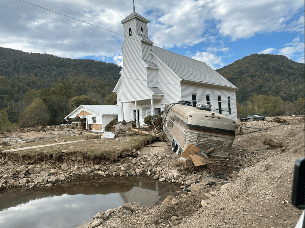 Hurricane Helene caused a tremendous amount of economic and environmental damage in Mitchell County, North Carolina. Sophia Phillips of the Appalachian Rebuild Project and Mitchell County Long Term Resilience Group shares that the community’s new “normal” is very different after the storm. “Everybody has suffered so much financially that it's been such a change in the normal quality of life,” she says. “The amount of stress, financial stress, has been associated with this for everybody. Almost everybody was out of work for multiple months.” Photo courtesy of Sophia Phillips