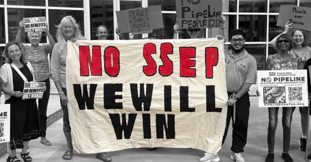 Protesters holding banner reading: "No SSEP; We will win"