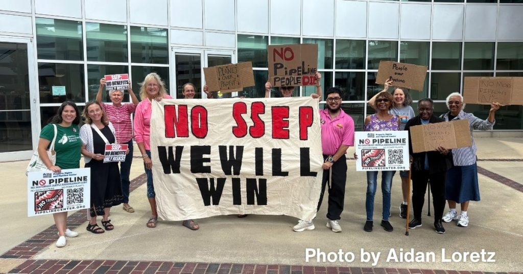 Protesters holding banner that reads "No SSEP. We will win."