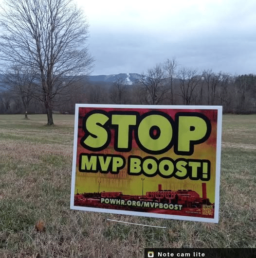 A yard sign with a "Stop MVP Boost" graphic on it.