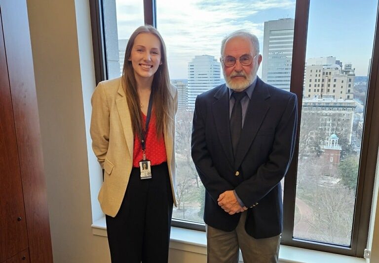 Bob Egbert meets with a Del. Joe McNamara's legislative aide during the 2025 Conservation Lobby Day.
