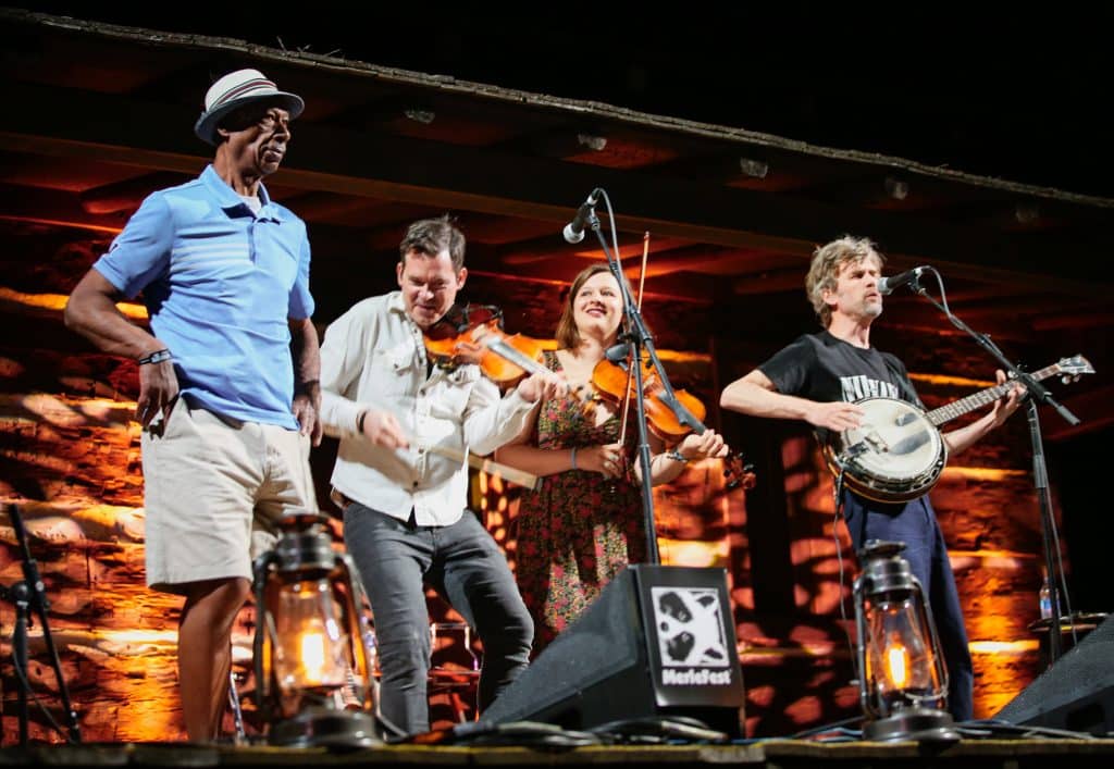 Arthur Grimes shares the stage with Old Crow Medicine Show at Merlefest in 2024. Photo by Light Shifter Studios / Bryce Lafoon