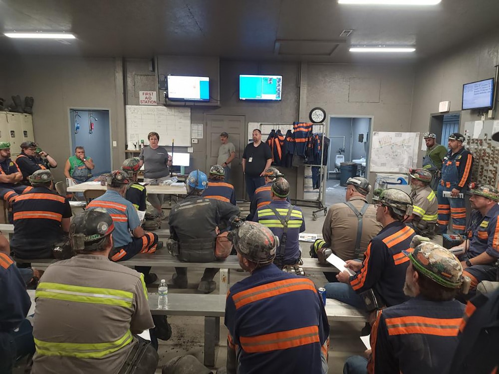 Anita Wolfe speaks with miners about the NIOSH Coal Workers’ Health Surveillance Program. Photo courtesy of Anita Wolfe