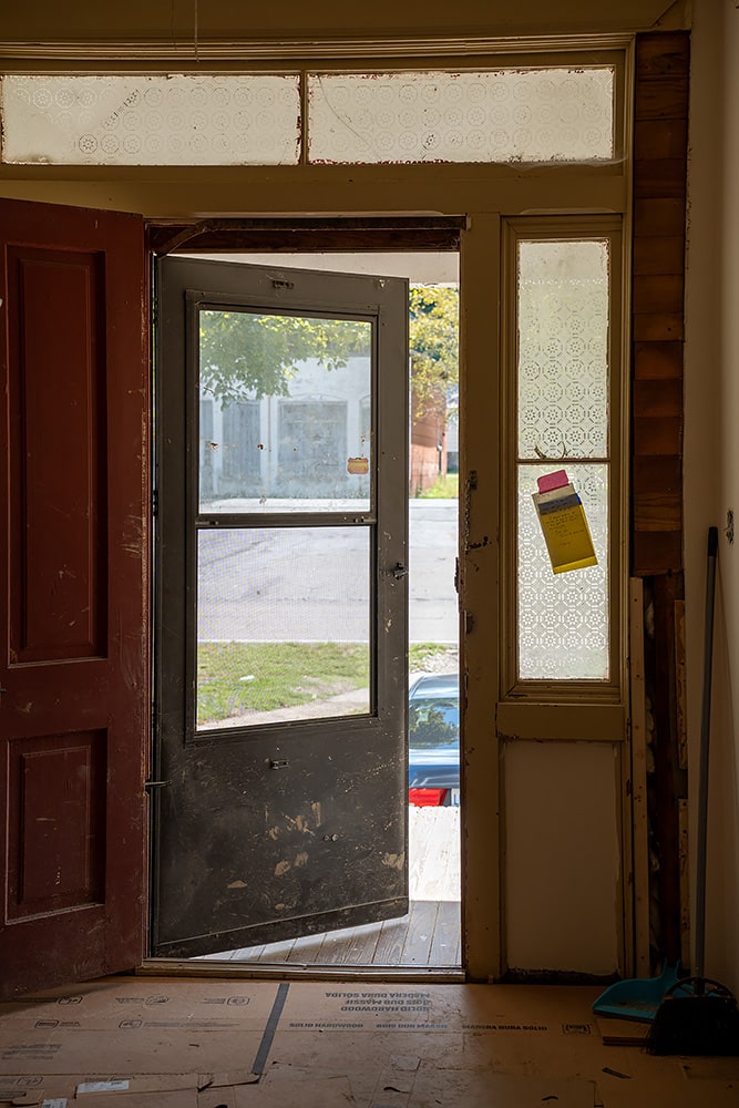 A damaged door in Theo Crouse-Mann’s home in Del Rio, Tennessee, which suffered extensive flood damage from the French Broad River. Photo by Abby Hassler
