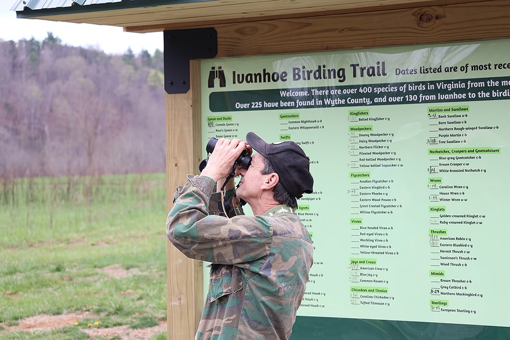 A man birdwatches on the Ivanhoe Birding Trail. Photo courtesy of Virginia Department of Conservation and Recreation