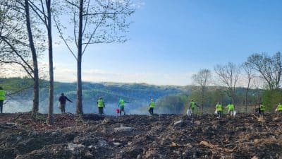 Williams Foresty & Associates crew spreading a pollinator and wildflower seed mix at the Quarry Drive site. Photo by Liz Holloway 