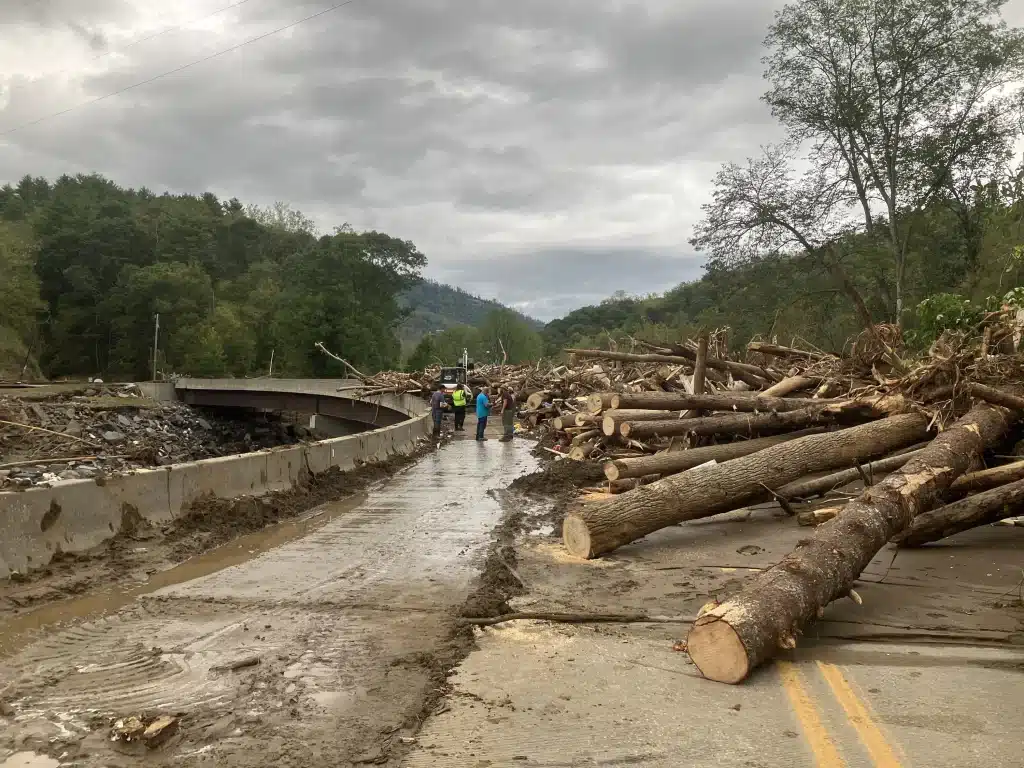 Downed trees on overpass after Helene in rural Yancey County, North Carolina