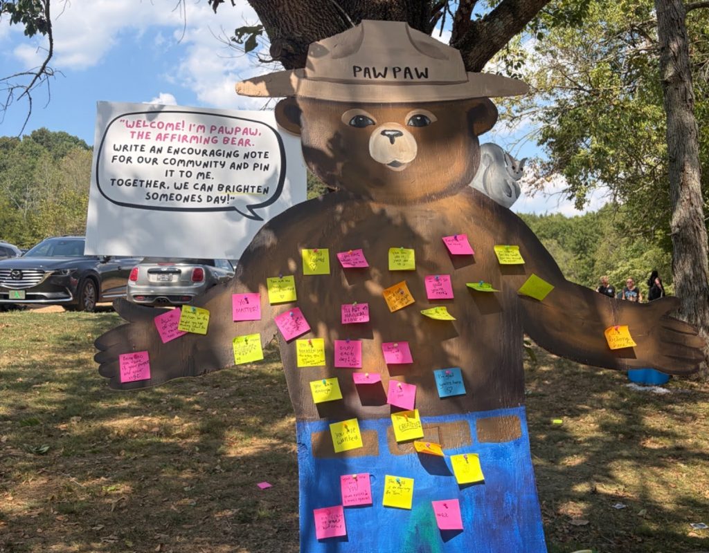 Attendees left sticky notes on the wooden “affirming bear” named PawPaw. Neon-colored notes expressed a variety of affirmations, including “Never dull your sparkle,” “What’s meant for you will never pass you by,” and “You’re enough!” Photo courtesy of Debra Murray
