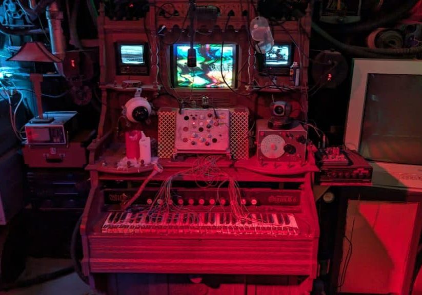 The Resonator, a century-old modified pump organ, is the centerpiece of one of the House of Art’s permanent exhibits, surrounded by creepy computer junk and red and blue and green neon lights